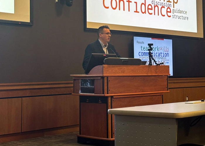 Photo of Adam Reid receiving the Dr Wallace Ingram award for Medical Education